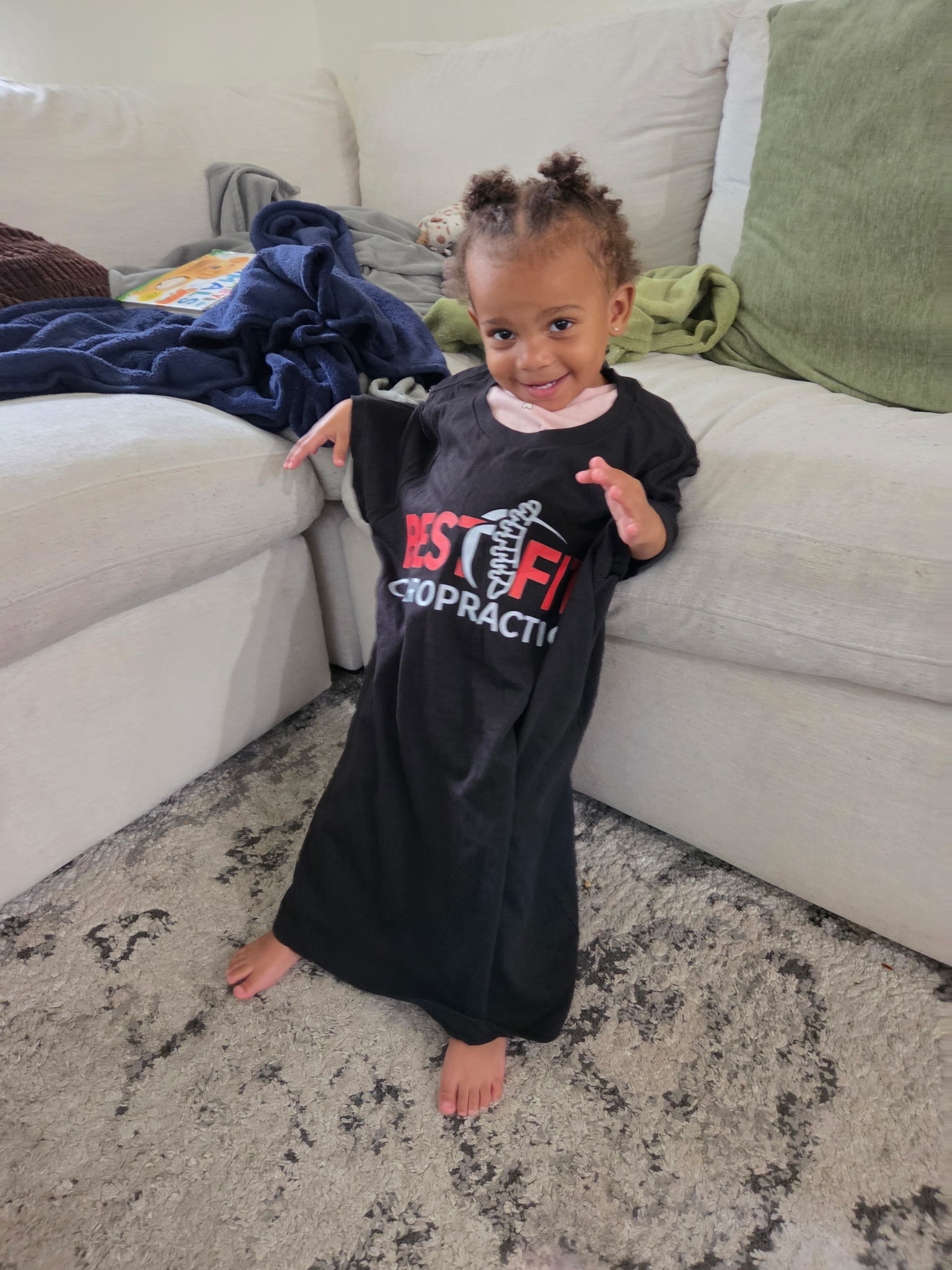 Young child wearing a BestFit Chiropractic shirt